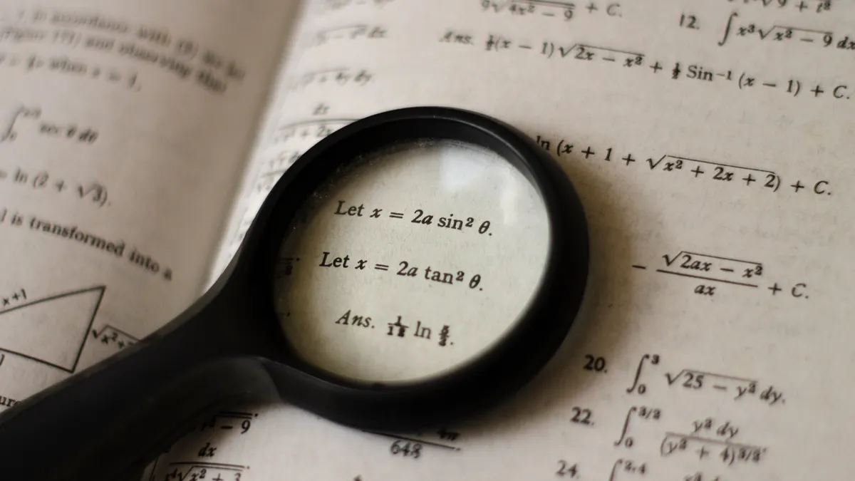 Magnifying glass over a textbook page